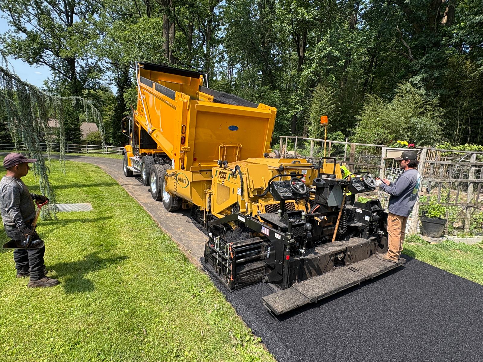 Horizon Paving crew laying asphalt driveway